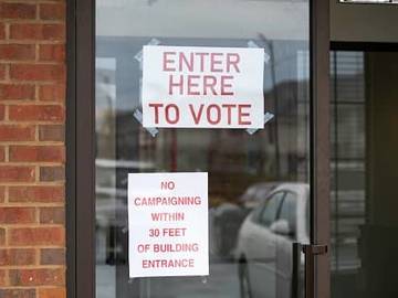 enter here to vote sign